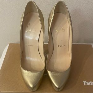 Gold Christian Louboutin pumps